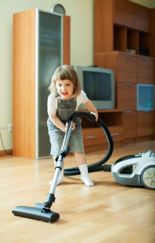 baby girl with vacuum cleaner